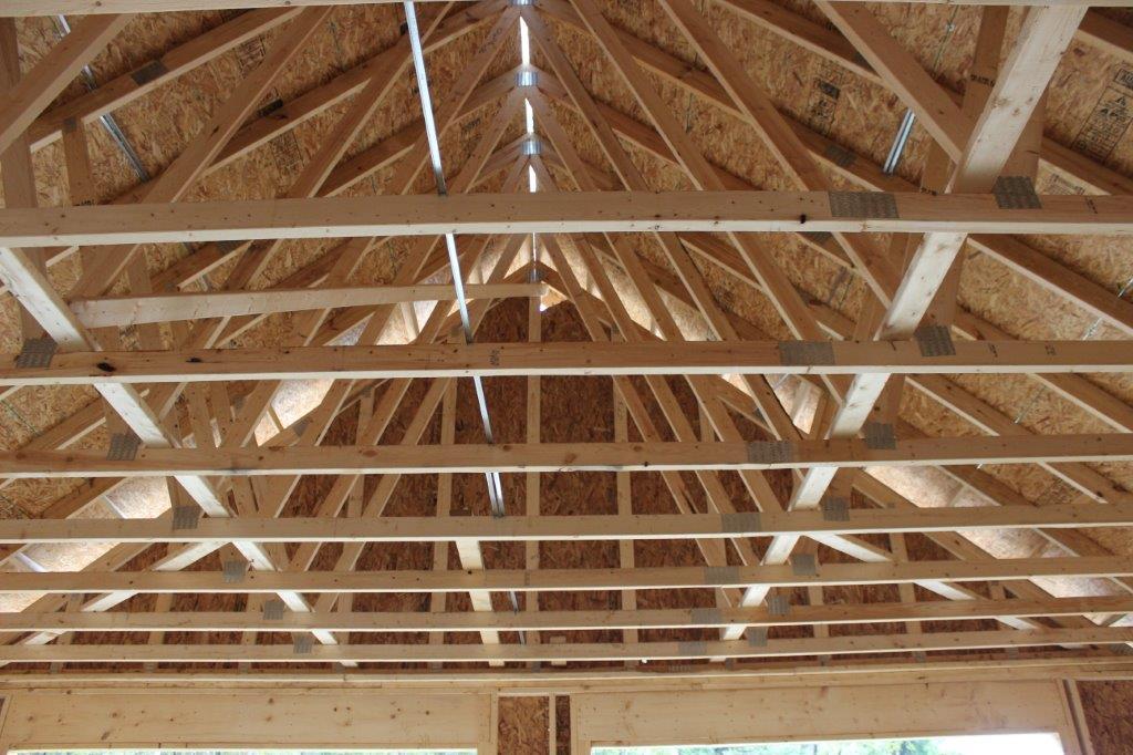 The client opted for conventional trusses without a bonus room in the garage area.  This will have tongue & groove pine applied for a beautiful garage.