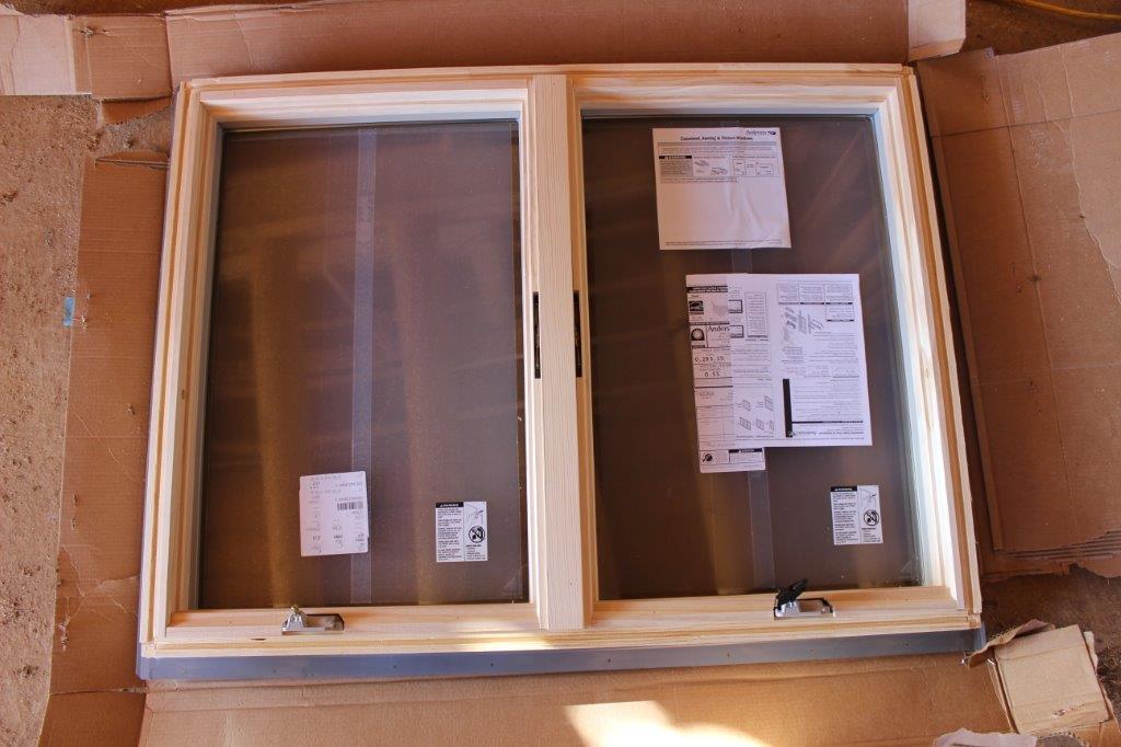 On 'window and door' day, the Andersen truck shows up with the standard patio doors and windows, the crew unloads them and starts to install them in the window & door bucks.  Each buck is custom made for the window or door that gets installed into it.